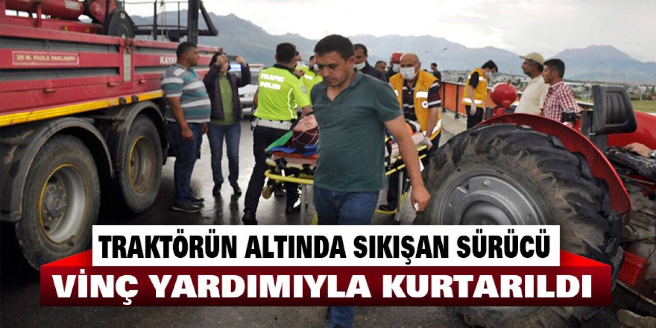 Traktörün altında sıkışan sürücü vinç yardımıyla kurtarıldı
