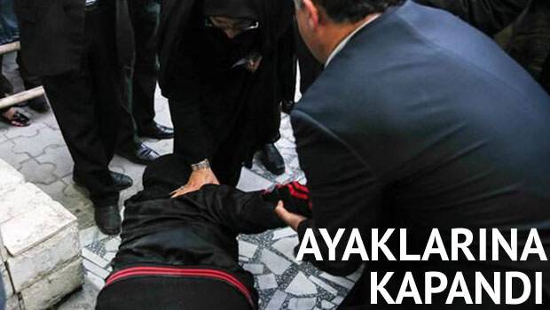 Ayaklarına kapandı