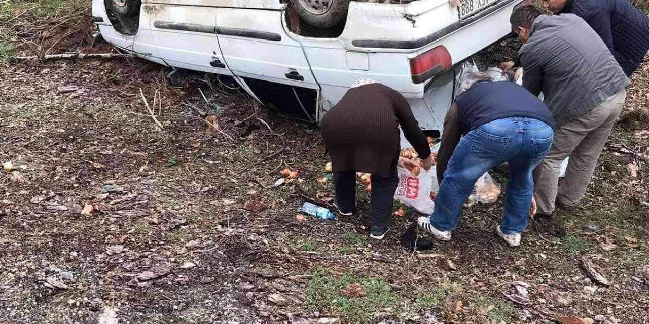 Taklalar atan otomobilden sağ kurtuldular
