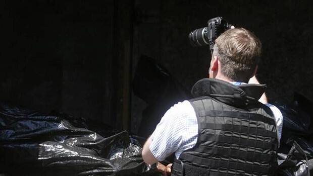 Malezya uçağının yolcuları Donetsk'teki morglara taşınıyor