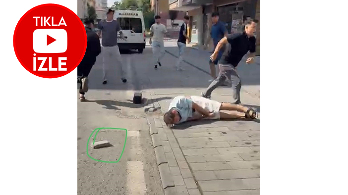 İki grup arasında kavga çıktı başına kaldırım taşını fırlattı