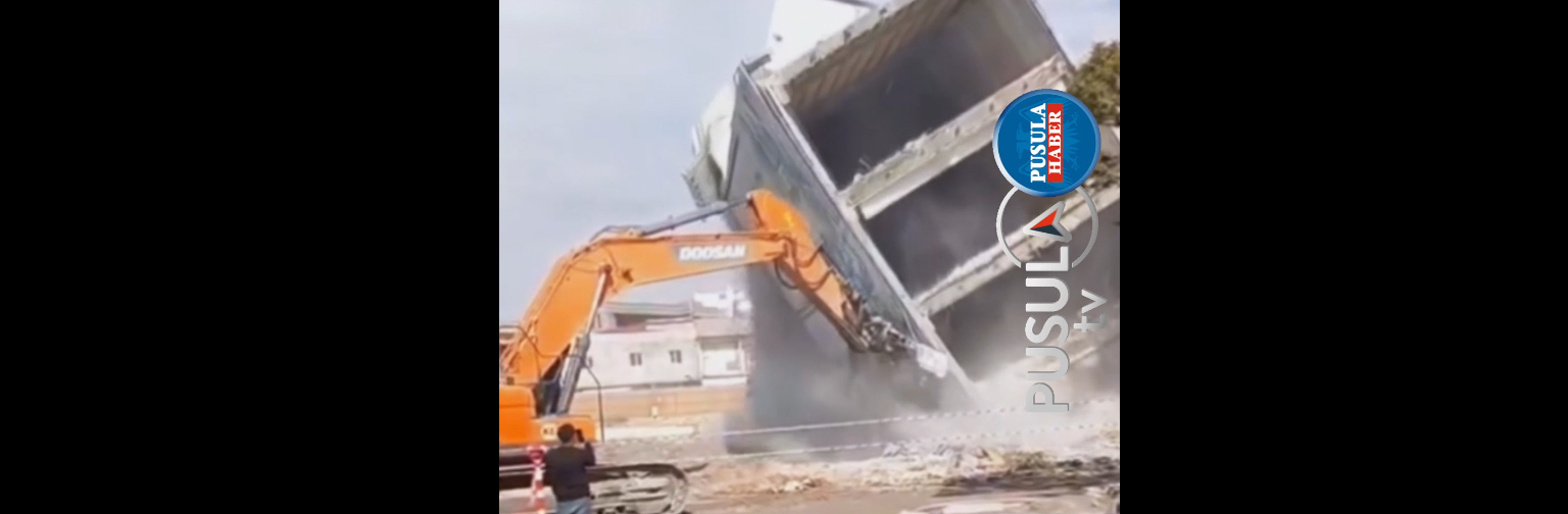 Ağır hasarlı binanın devrilmesi cep telefonu kamerasında