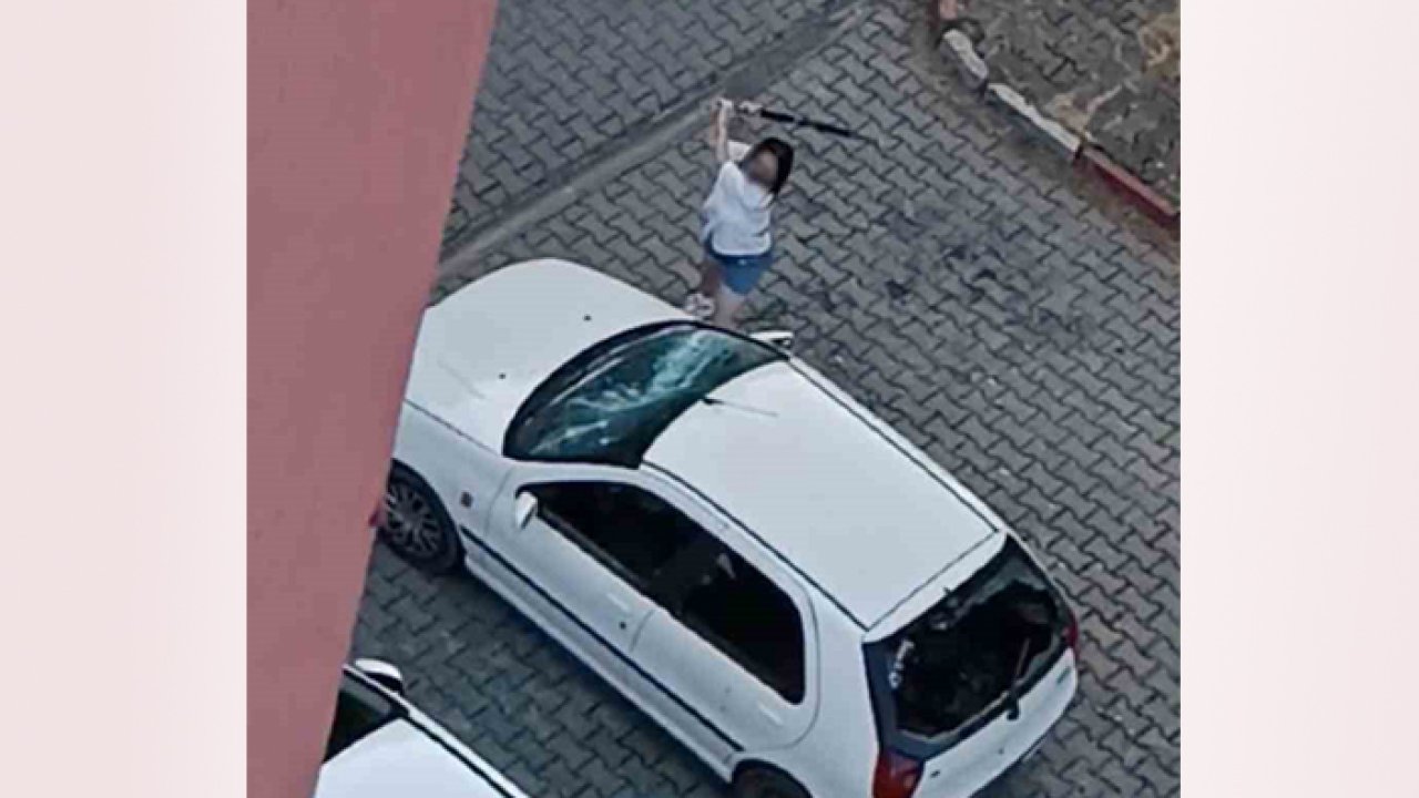 Öfkeli kadın arabanın camlarını tuzla buz etti!