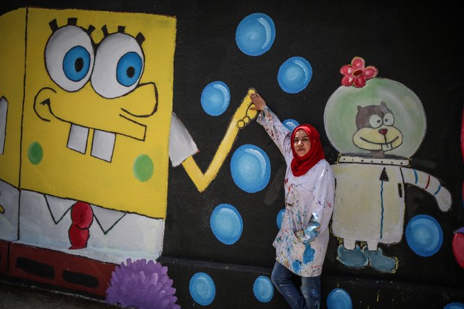 Gazze'nin duvarlarına Filistin kültürünü resmediyorlar