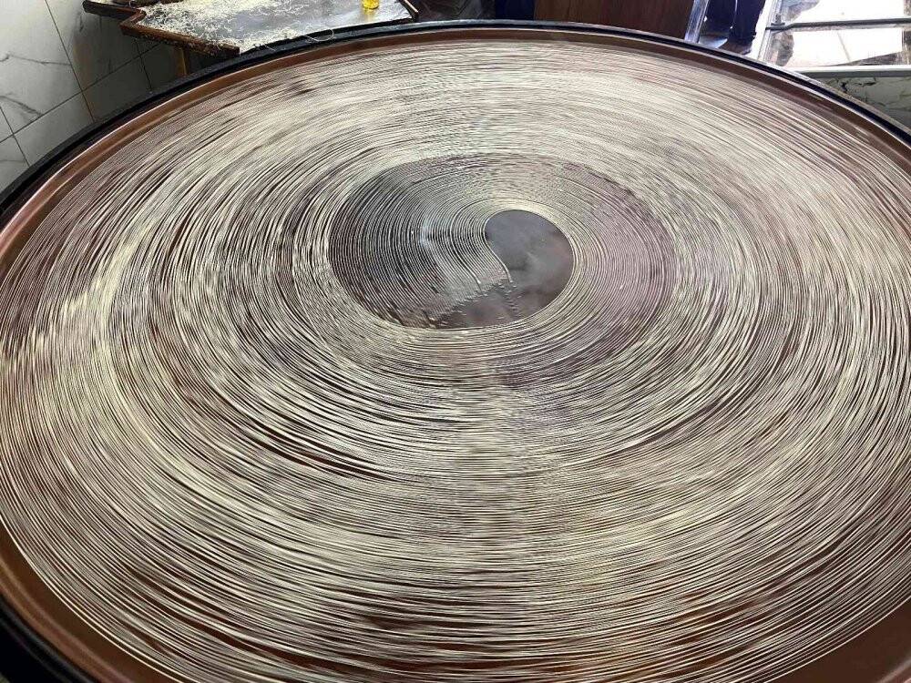 Konya'da geleneksel yöntemlerle üretilen tel kadayıf sofraları tatlandırıyor