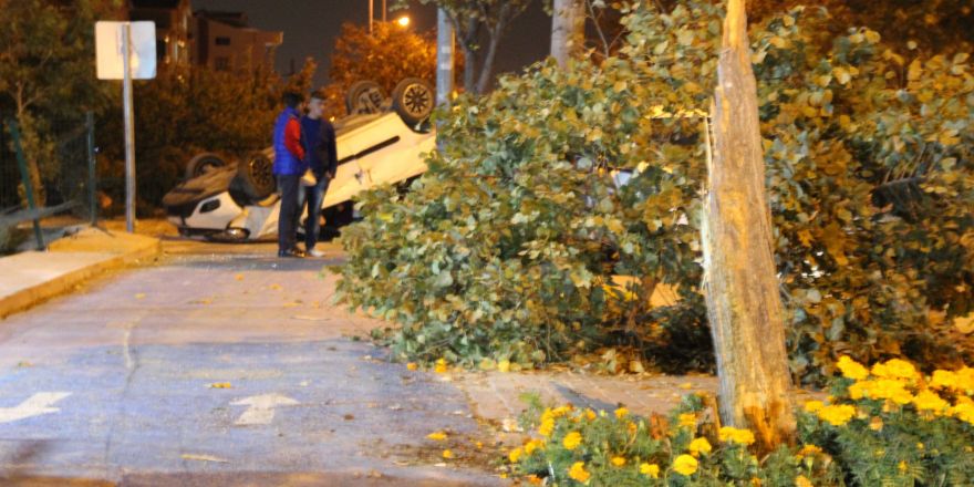 Takla atan araçtan yaralı kurtuldular